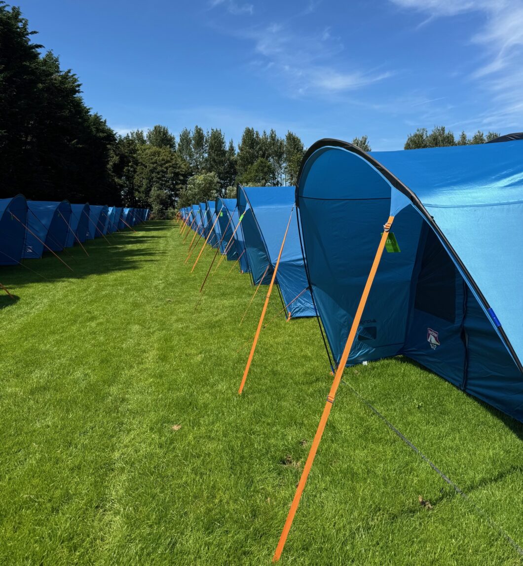 Row of pre-pitched tents at The Pop-Up Camp