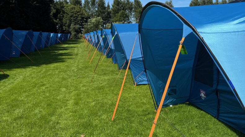 Row of pre-pitched tents at The Pop-Up Camp