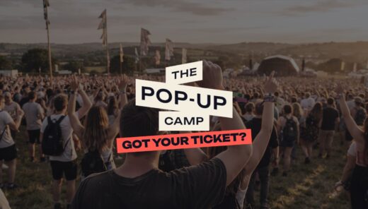 Festival crowd at sunset with The Pop-Up Camp logo and the line Got your ticket?