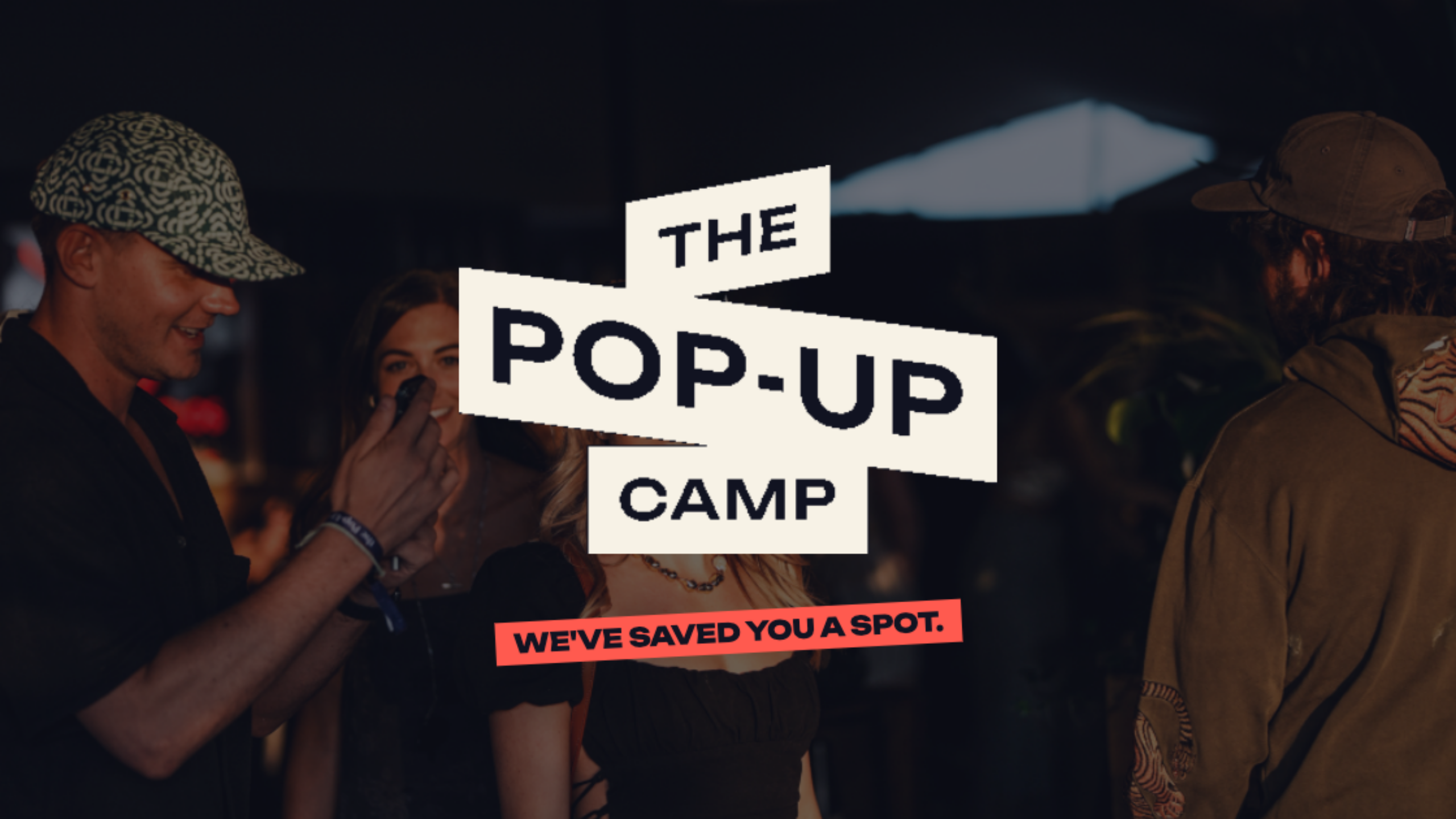 The Pop-Up Camp logo over guests at night. We've saved you a spot.